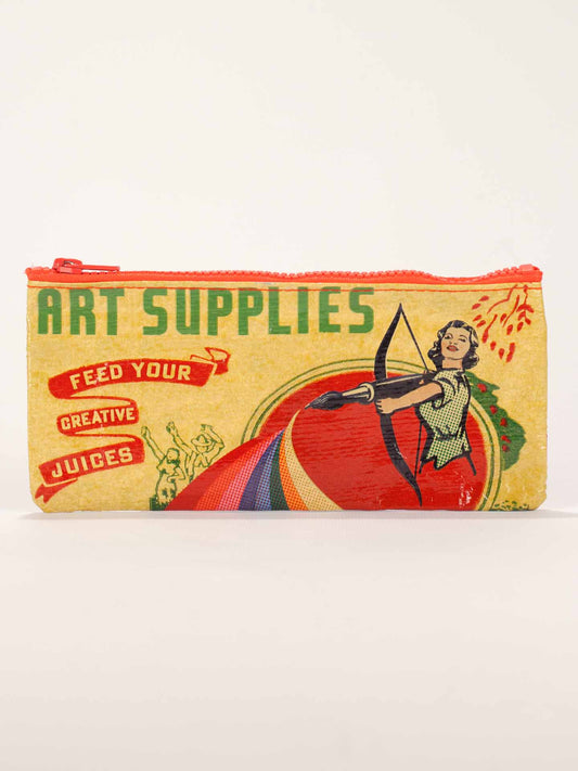 The Blue Q Art Supplies Pencil Case is rectangular with a red zipper, features “ART SUPPLIES,” a vintage woman archer, rainbow colors, and the phrase “FEED YOUR CREATIVE JUICES.”.