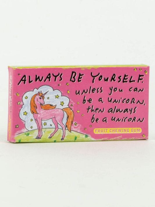 A pink box of Blue Q's Always Be Yourself Unless You Can Be A Unicorn Gum, featuring fruit flavor, a unicorn illustration, and the text: "Always be yourself. Unless you can be a unicorn, then always be a unicorn.