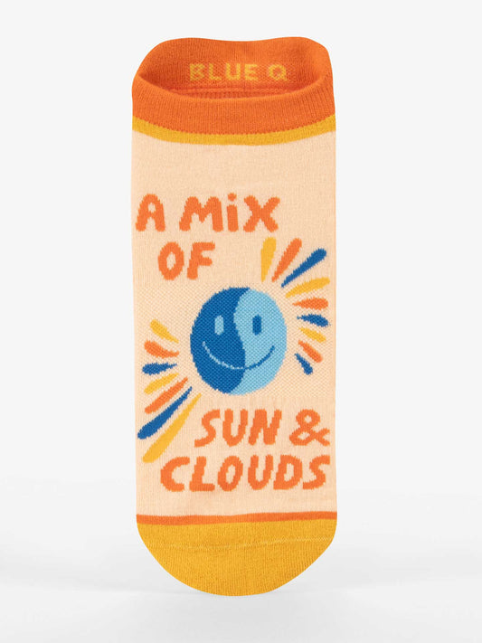 Blue Q’s A Mix Of Sun & Clouds Sneaker Socks feature orange, yellow, and blue accents, a smiling sun and cloud graphic, and “A MIX OF SUN & CLOUDS” text. Enjoy all-day comfort with these cushioned, vibrant socks.