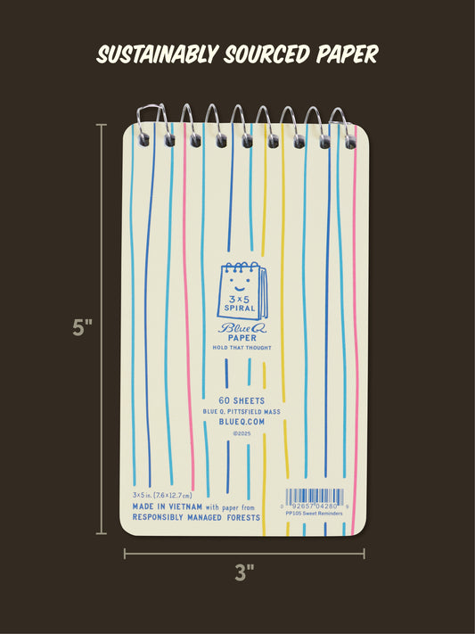 The Blue Q "Sweet Little Reminders For My Stupid Husband" 3x5 spiral notebook features a white cover with wavy lines, 60 sheets of sustainably sourced paper, and is perfect for quick notes or a fun romantic gift.