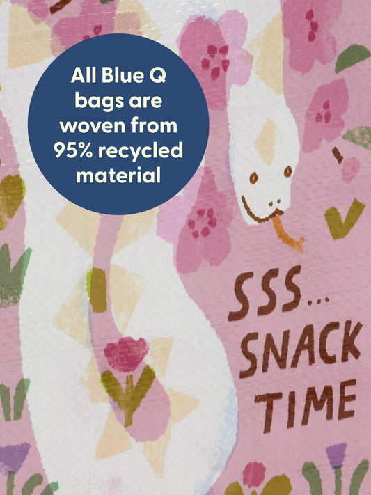 An illustration of a white snake with yellow spots among pink flowers appears on the Sss...Snack Time Handy Tote by Blue Q. A blue circle reads: “All Blue Q bags are woven from 95% recycled material.” Below the snake: “SSS... SNACK TIME—perfect for holding all your favorite reptile snacks!”.