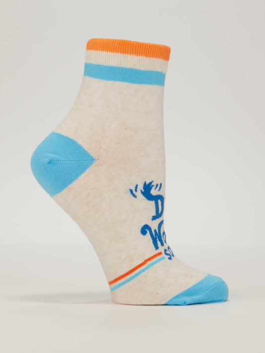 Blue Q Dog Walkin' W-Ankle Socks for women—beige with blue toe and heel, orange/blue cuff stripes, blue text, and a moose graphic. Shown on a mannequin foot against a white background; perfect comfy or dog walking socks.
