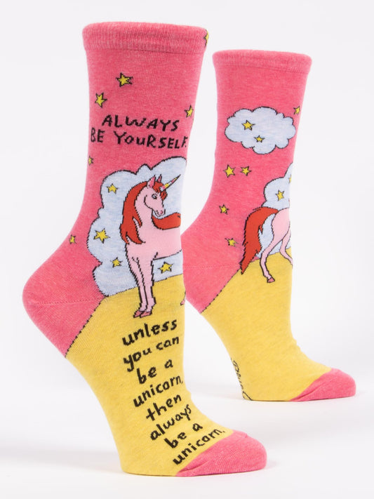 Blue Q Always Be Yourself Unless You Can Be A Unicorn W-Crew Socks feature a fun unicorn, clouds, and stars design with the playful quote. Add magic to your day with these whimsical socks!.