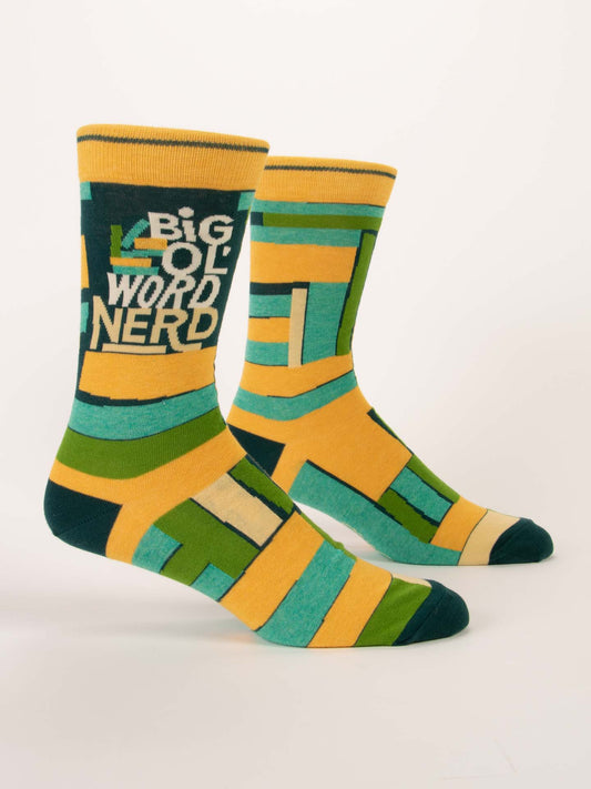 Blue Q’s Big Ol' Word Nerd M-Crew Socks feature bold yellow, green, teal, and blue geometric patterns with "BIG OL WORD NERD" printed in white on the side.