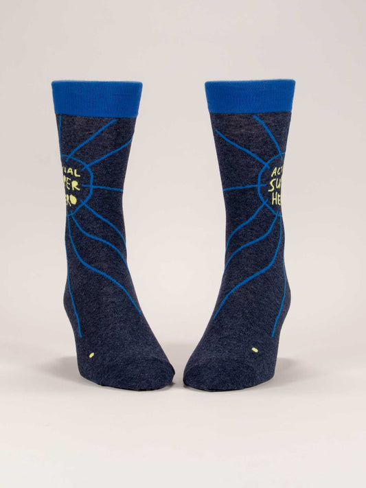 Blue Q’s Actual Superhero M-Crew Socks feature dark blue combed cotton, bright blue cuffs, decorative lines, and “ACTUAL SUPER HERO” in yellow within a circle—a perfect pair for everyday heroes.