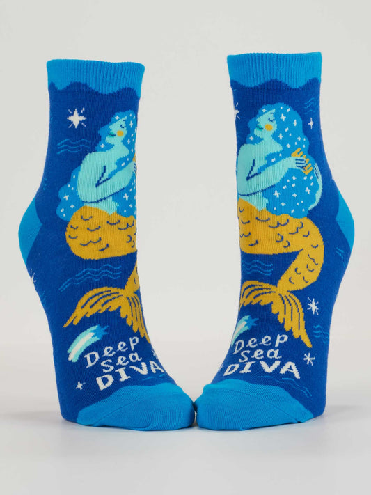 Blue Q Deep Sea Diva W-Ankle Socks: Blue cotton socks feature an illustrated yellow-tailed mermaid with blue hair, stars, and bubbles, plus "Deep Sea Diva" at the toes in white and light blue—perfect for pop music fans.