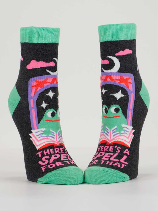 Blue Q’s There’s A Spell For That W-Ankle Socks feature green accents, a cartoon frog with moon, stars, pink clouds, an open book, and “There’s a spell for that” text. Fits women’s shoe sizes 5-10.